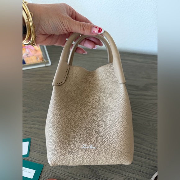 Loro Piana Handbags - Loro piana micro bale bag in tan calfskin; used 4x